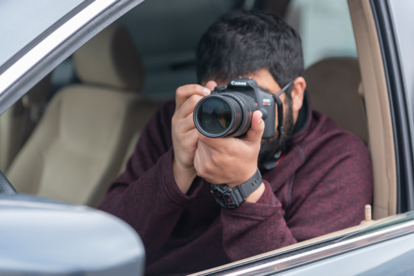 a man in a car with a camera